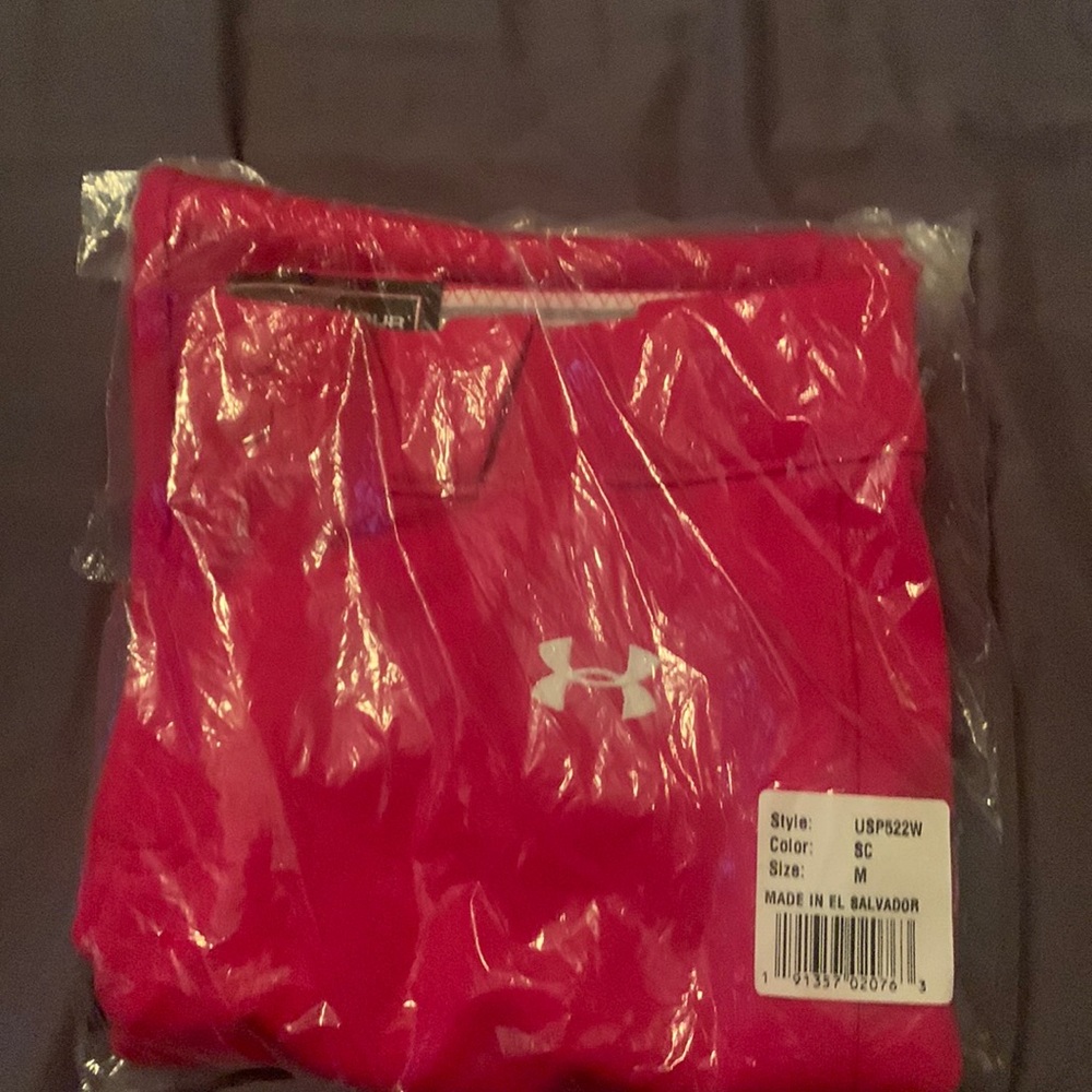 Brand new. Never opened under armour softball pants size medium. Red